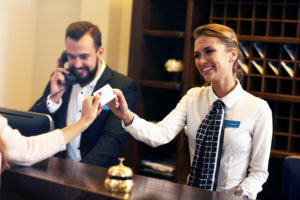 Picture of guests getting key card in hotel